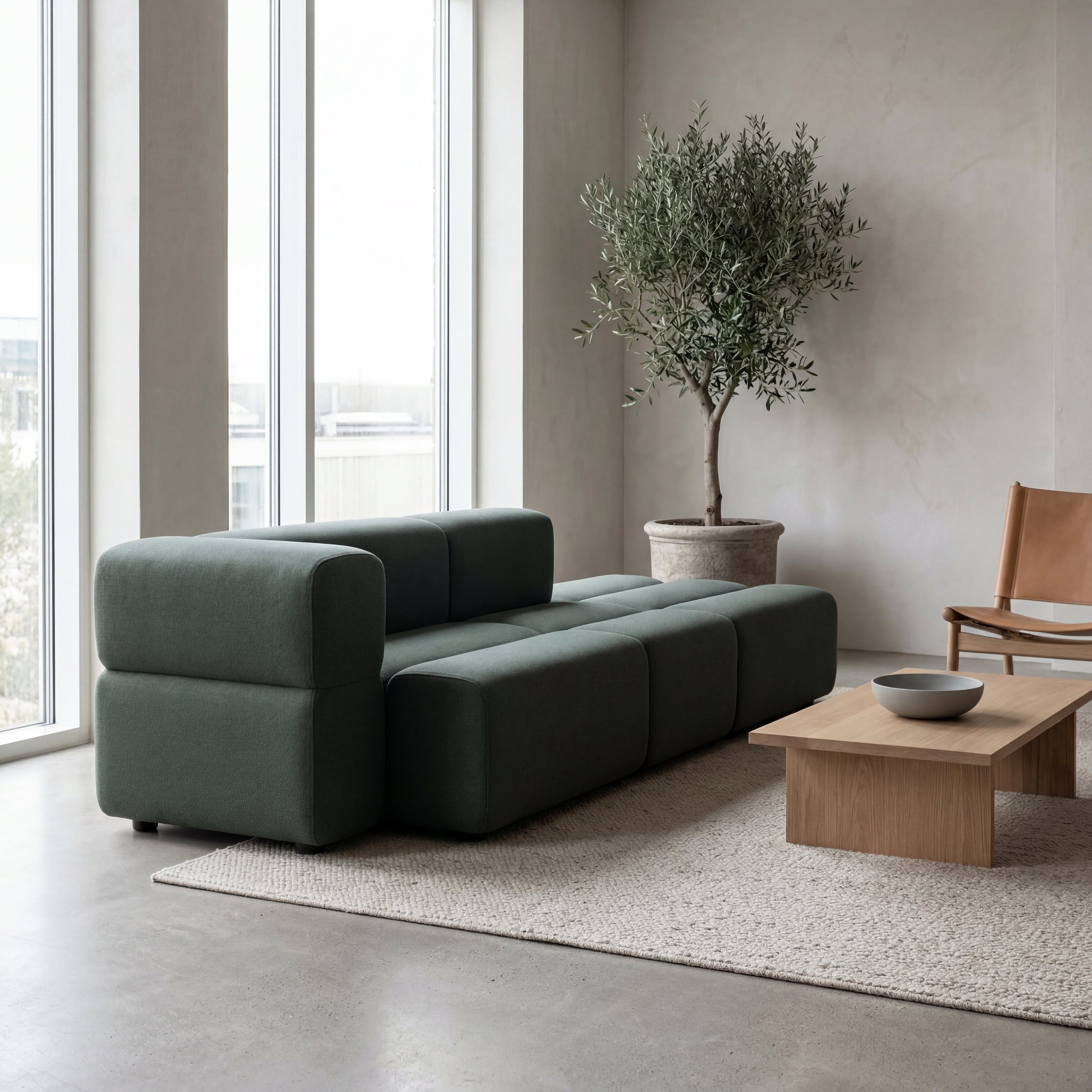 Kontor B: grønn KEEEP-sofa i sosial sone.